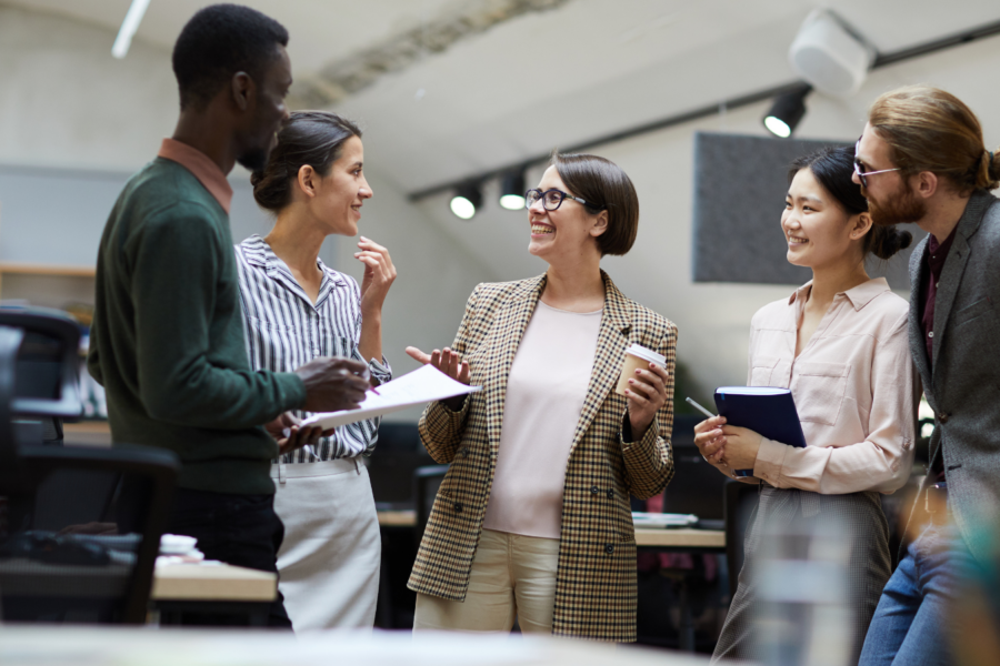 5 people talking in the office